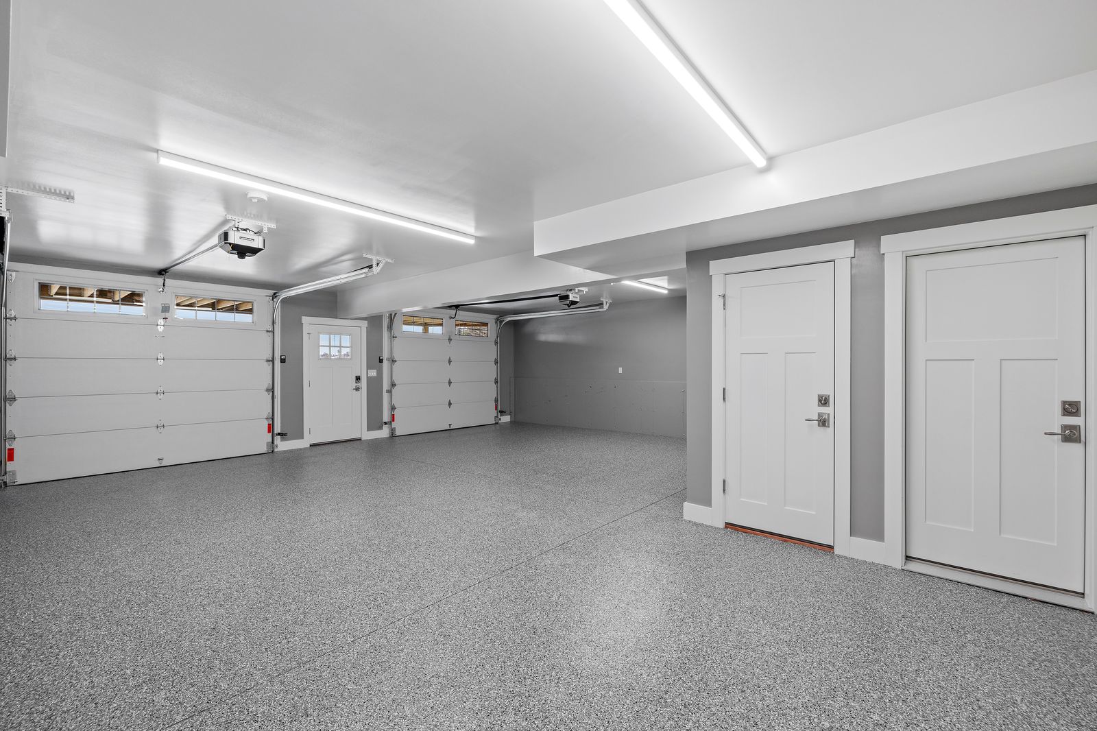 Bright, clean garage with a coated concrete floor in a Gold Canyon home